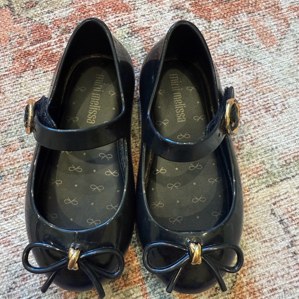 Mini Melissa Black Dress Shoes with Gold Bow